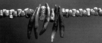 Detail of necklace from a burial at Sungir, Russia, 28,000 BP. Interlocking and interchangeable beads. Each mammoth ivory bead may have required one to two hours of labor to manufacture. 