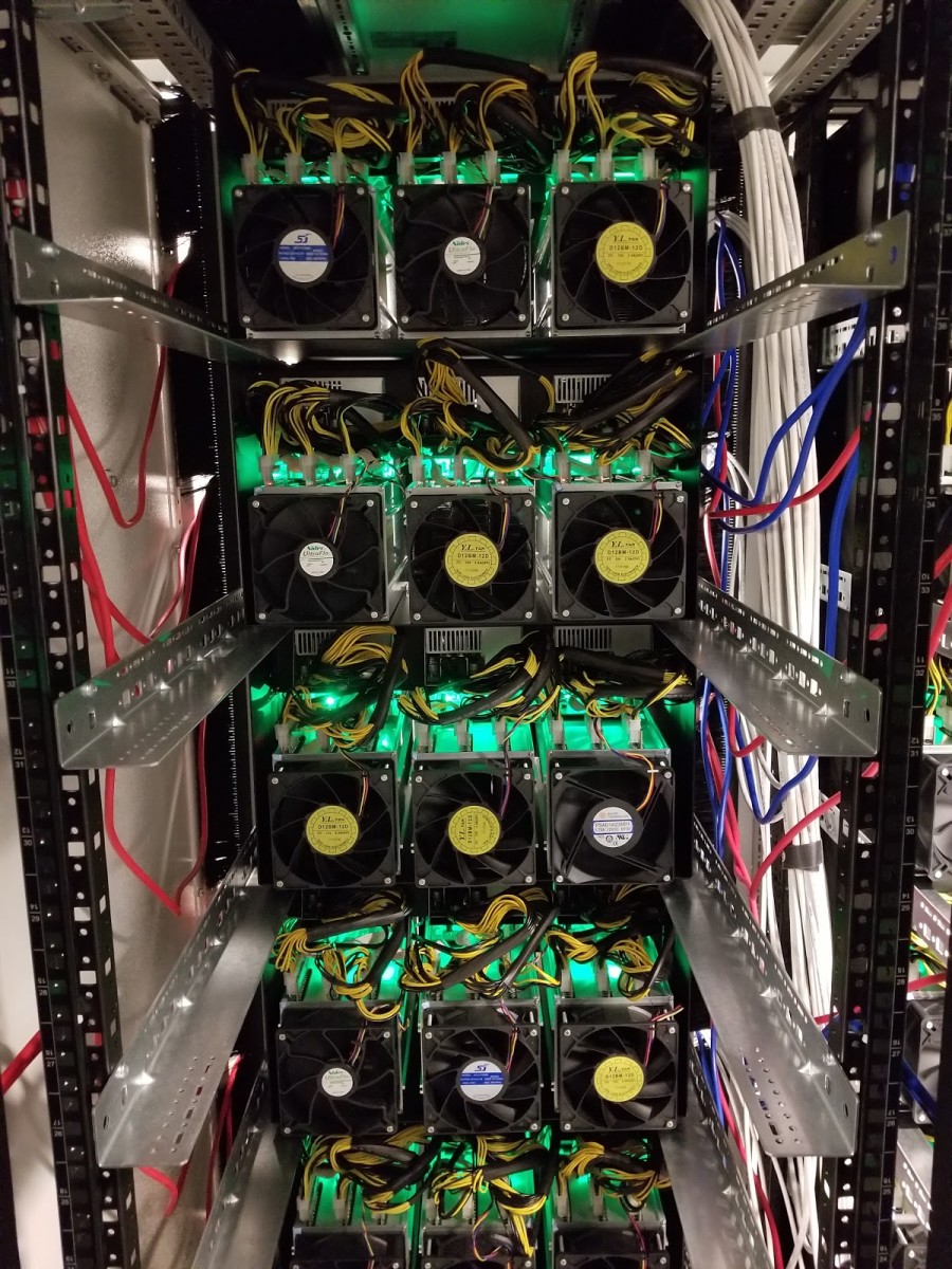 The backside of the mining rigs emit a powerful exhaust.