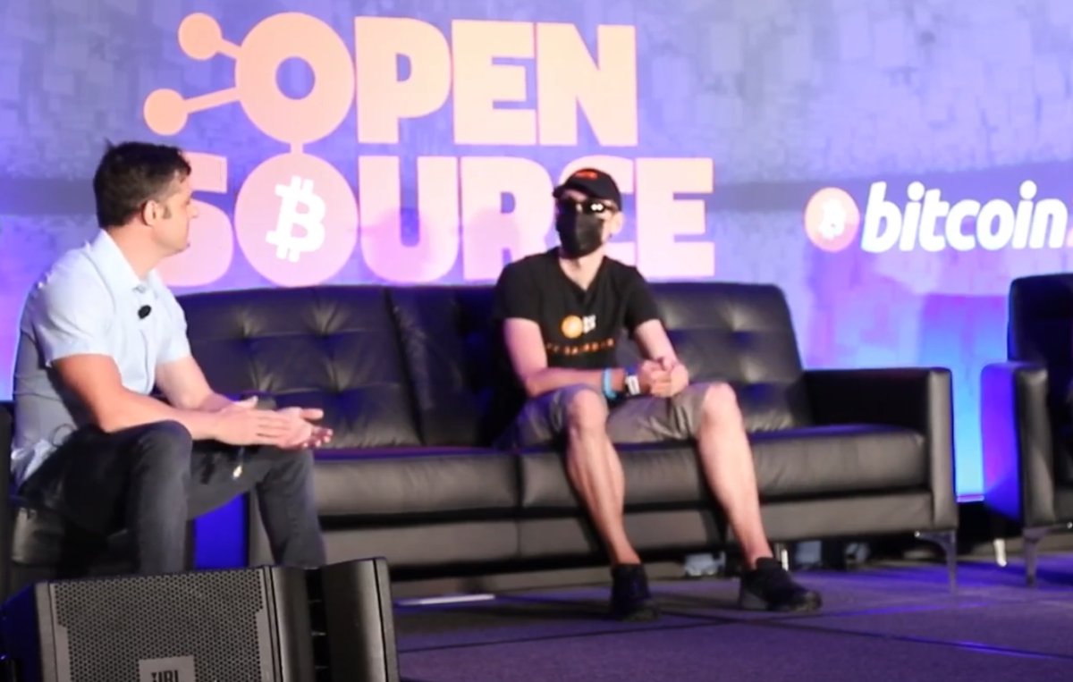 Casey Rodarmor left) and Eric Sirion (right) presenting behind a mask and glasses at Bitcoin 2022 in Miami