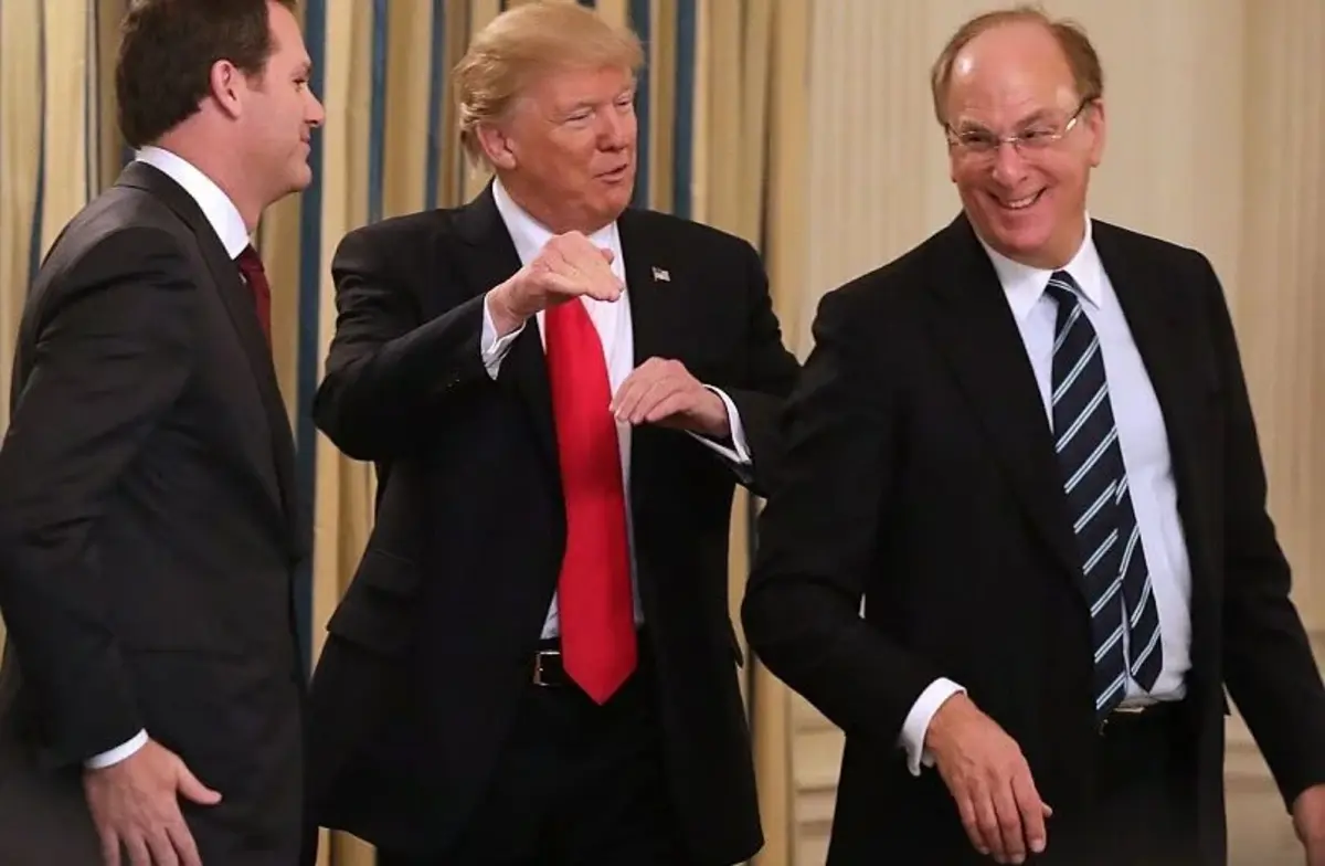 Trump (center) speaks with WalMart CEO Doug McMillon (left) and BlackRock’s Larry Fink (right) at the White House in February 2017 – Source