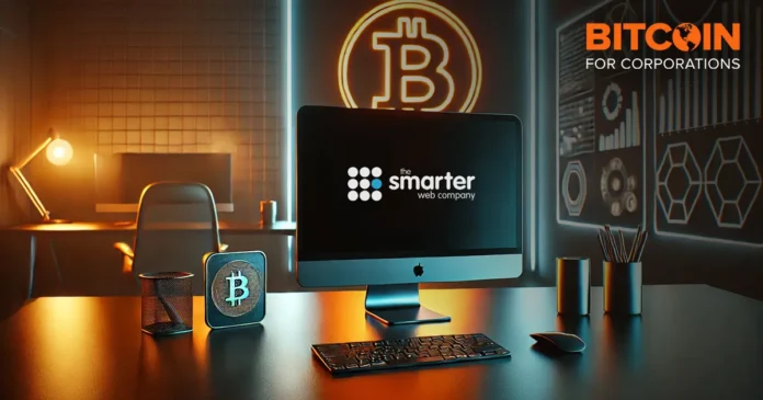 Smarter Web Company computer lab with Bitcoin sign glowing in office backdrop